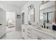 Bathroom with double sink vanity, modern fixtures, and doorway view to main bedroom at 1244 Crooked Oak Rd, Charleston, SC 29492