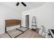 Bedroom with an empty bed frame, ceiling fan, and an open door at 1244 Crooked Oak Rd, Charleston, SC 29492