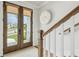 Bright entryway showcasing double doors with roller shades and stairway at 1244 Crooked Oak Rd, Charleston, SC 29492