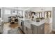 A gourmet kitchen featuring a large island, stainless steel appliances, and an open layout at 1244 Crooked Oak Rd, Charleston, SC 29492