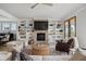 Cozy living room featuring a fireplace, built-in shelving, and a view of the doors to the porch at 1244 Crooked Oak Rd, Charleston, SC 29492