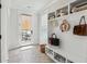 Well-organized mudroom with built-in storage, stylish decor, and convenient access to the outdoor patio at 1244 Crooked Oak Rd, Charleston, SC 29492