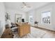 Bright office with a wooden desk and comfortable chair with nice decor and plants at 1244 Crooked Oak Rd, Charleston, SC 29492