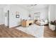 Bright office with a large desk, comfortable seating, and hardwood floors at 1244 Crooked Oak Rd, Charleston, SC 29492