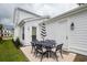 Cozy backyard patio with outdoor seating, ideal for entertaining, offers views of the home's exterior at 1244 Crooked Oak Rd, Charleston, SC 29492