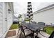 Back patio with outdoor seating offers a private setting with home exterior and neighborhood views at 1244 Crooked Oak Rd, Charleston, SC 29492