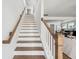Staircase with wood and white trim, connecting to the main level and upper floors at 1244 Crooked Oak Rd, Charleston, SC 29492