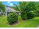 A lush backyard with a well-manicured lawn and mature trees at 125 Macy Cir, Goose Creek, SC 29445