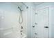 Bathroom featuring a shower and tub combination, complemented by a white door at 125 Macy Cir, Goose Creek, SC 29445