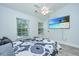 Comfortable bedroom with ceiling fan, and large windows and an entertainment center at 125 Macy Cir, Goose Creek, SC 29445