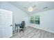 Bright bedroom featuring a ceiling fan, wood floors, and a large window offering natural light at 125 Macy Cir, Goose Creek, SC 29445