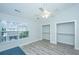 A light-filled bedroom with a ceiling fan, wood floors, and two closets, offering ample storage at 125 Macy Cir, Goose Creek, SC 29445