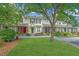 Landscaped townhome exteriors with colorful doors, lush green lawns and sidewalks at 125 Macy Cir, Goose Creek, SC 29445