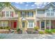 Attractive townhomes with colorful doors, landscaping and lush green lawns at 125 Macy Cir, Goose Creek, SC 29445