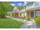 Townhome exteriors with manicured lawns and walkways create a welcoming atmosphere at 125 Macy Cir, Goose Creek, SC 29445
