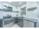 Bright modern kitchen featuring stainless steel appliances and subway tile backsplash at 125 Macy Cir, Goose Creek, SC 29445