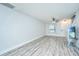 Open living space with hard surface floors, ceiling fan and white walls at 125 Macy Cir, Goose Creek, SC 29445