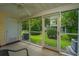 Inviting screened porch providing a relaxing view of the landscaped backyard at 125 Macy Cir, Goose Creek, SC 29445