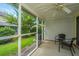 Cozy screened porch with seating overlooking the lush backyard at 125 Macy Cir, Goose Creek, SC 29445