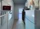 Basement with a freezer, furnace, laundry area, tiled floor and a walk-out door at 1261 Hampshire Rd, Charleston, SC 29412