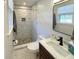 Modern bathroom featuring hexagon floors, stylish vanity, and tiled shower at 1261 Hampshire Rd, Charleston, SC 29412