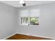 Cozy bedroom with hardwood floors, gray walls, and a large window for natural light at 1261 Hampshire Rd, Charleston, SC 29412