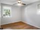 Bright bedroom with hardwood floors, neutral walls, and a large window offering ample natural light at 1261 Hampshire Rd, Charleston, SC 29412