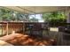 Wooden deck with a table and 4 chairs and a view of a backyard at 1261 Hampshire Rd, Charleston, SC 29412