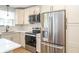Contemporary kitchen with stainless steel appliances, white cabinets, and elegant backsplash at 1261 Hampshire Rd, Charleston, SC 29412