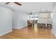 Hardwood floor living area flows into a modern kitchen with a breakfast bar and dining nook at 1261 Hampshire Rd, Charleston, SC 29412