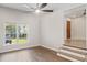 Bright living room with new flooring, a view of the front yard, and an open transition to the front door at 1261 Hampshire Rd, Charleston, SC 29412
