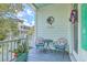Charming balcony with cushioned chairs, a bistro table, and a view of the neighborhood at 129 Howard Mary Dr # A, Charleston, SC 29412