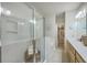 Bright bathroom with a glass-enclosed shower and double sink vanity with wood cabinets, plus access to walk-in closet at 129 Howard Mary Dr # A, Charleston, SC 29412