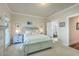 Airy bedroom with a soothing coastal theme, neutral colors, and a view to the bathroom at 129 Howard Mary Dr # A, Charleston, SC 29412