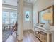Bright entryway with a stylish console table, mirror, and view into the dining area at 129 Howard Mary Dr # A, Charleston, SC 29412