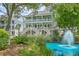 Three-story home with double balconies overlooking a beautiful lagoon and fountain at 129 Howard Mary Dr # A, Charleston, SC 29412