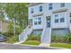 Charming two-story townhouse with stairs leading to the front door and tasteful landscaping at 129 Howard Mary Dr # A, Charleston, SC 29412