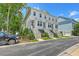 Inviting two-story townhouses feature white siding, complemented by well-maintained landscaping and private entrances at 129 Howard Mary Dr # A, Charleston, SC 29412