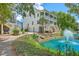 Three-story home with a backyard lagoon and a charming stone pathway at 129 Howard Mary Dr # A, Charleston, SC 29412