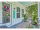 Inviting front porch with a patriotic wreath, welcome sign, and charming decor at 129 Howard Mary Dr # A, Charleston, SC 29412