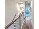 Bright hallway features wood floors, white trim, and leads to a bedroom, creating a warm and inviting atmosphere at 129 Howard Mary Dr # A, Charleston, SC 29412