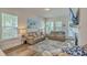 Bright and airy living room with large windows and comfortable leather seating at 129 Howard Mary Dr # A, Charleston, SC 29412