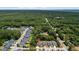 Highlighted aerial view of neighborhood with lush surrounding trees, and an indicator above subject house at 1300 Enfield Ln, Mount Pleasant, SC 29466