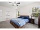 Light-filled bedroom showcases a queen bed and ensuite bathroom with double sink at 1300 Enfield Ln, Mount Pleasant, SC 29466