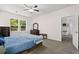 Charming bedroom featuring grey carpet and a bed with a blue quilt at 1300 Enfield Ln, Mount Pleasant, SC 29466