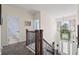 Bright foyer looking over the stairs and a view of the entry door at 1300 Enfield Ln, Mount Pleasant, SC 29466