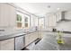 Bright kitchen boasts granite countertops, stainless steel appliances, and ample cabinet space at 1300 Enfield Ln, Mount Pleasant, SC 29466