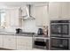 Well-equipped kitchen with stainless steel appliances, modern cabinetry, and a sleek gas cooktop at 1300 Enfield Ln, Mount Pleasant, SC 29466