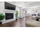 Open living space featuring a fireplace and view into the kitchen and backyard at 1300 Enfield Ln, Mount Pleasant, SC 29466