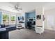 Comfortable room with ceiling fan, tv, couch, and desk space at 1300 Enfield Ln, Mount Pleasant, SC 29466